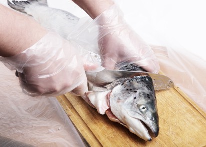 cleaning fish with gloves