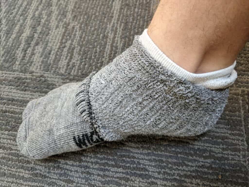 me-pulling-down-outer-sock-to-reveal-inner-sock