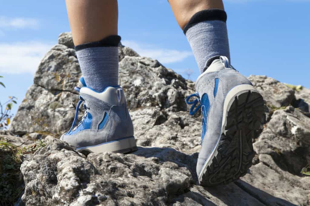 person with tall hiking socks and high top hiking shoes